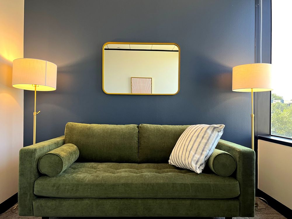 Cozy green couch where the magic of healing will happen!