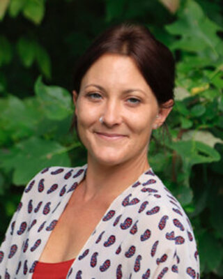 Photo of Rhiannon Leslie Burk, Licensed Clinical Mental Health Counselor, LCMHC, R-DMT, LCAS-A