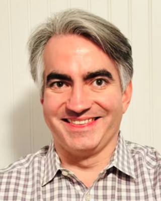 Photo of John Manzoni Darpino, Counselor, LMHC