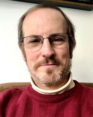 Photo of John Daken, MD, BC, Psychiatrist