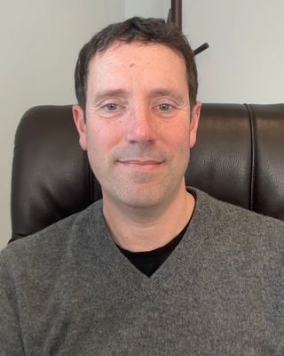 Photo of Adrian Zelvy, Counselor, LCPC