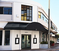 Gallery Photo of Paid parking available in front, and behind Red Sunset Building