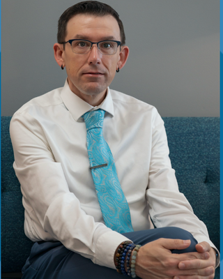 Photo of Dr. Michael Stinnett, Psychologist, PsyD, LP, HSP-P