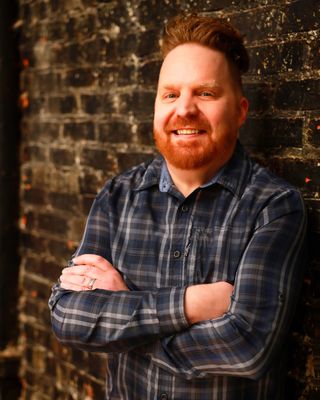 Photo of Dustan Toth, Counselor, LCPC