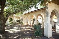 Gallery Photo of The Burning Tree Ranch archway greets families and clients.
