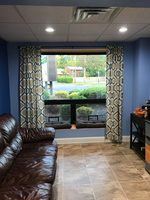 Gallery Photo of Our waiting room has access to wifi, a charging station, coffee, tea, and a comfortable couch to relax on while you wait for your session.
