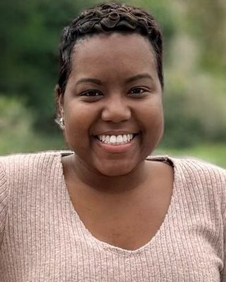 Photo of Ndia C Olivier - Ndia, Rooted In Resilience Wellness Collective , LICSW, Clinical Social Work/Therapist