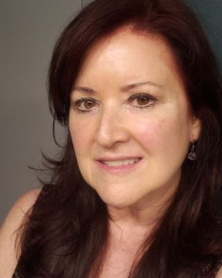 Photo of Ann M. Aguirregaviria, MEd, RMHCI, NCC, BCaBA