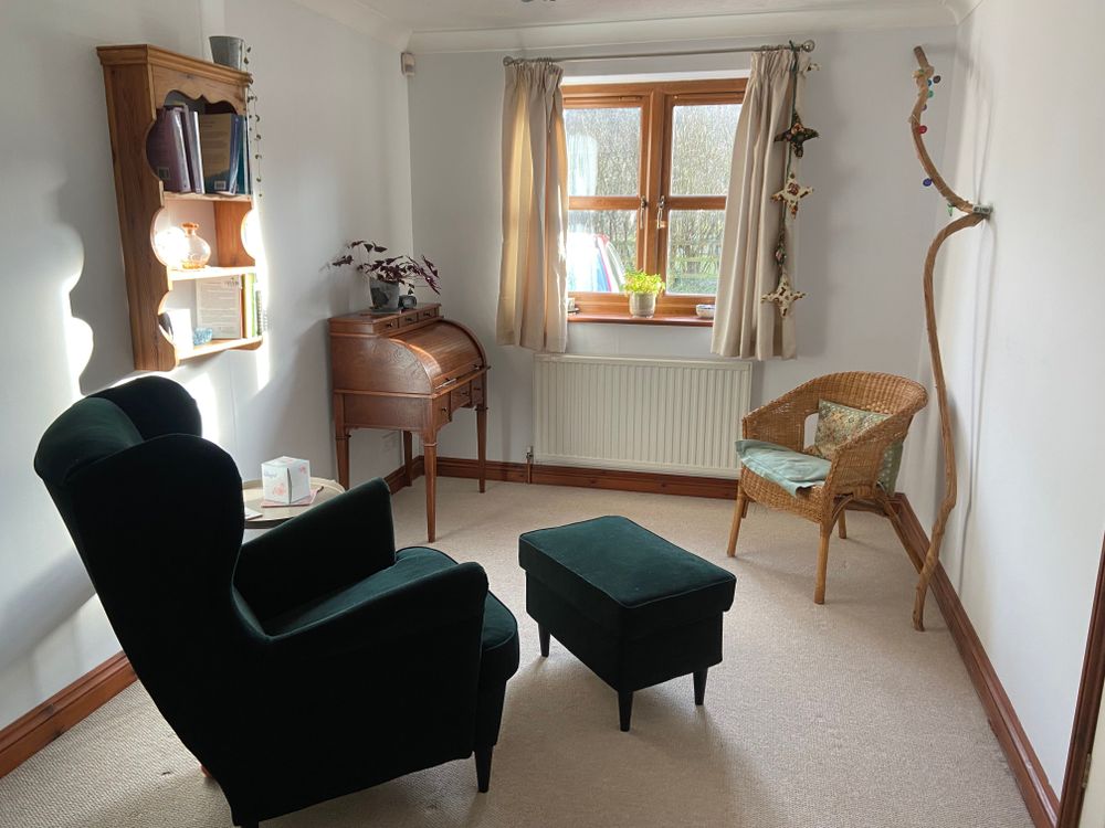 My peaceful and welcoming therapy room overlooking fields and woodland.