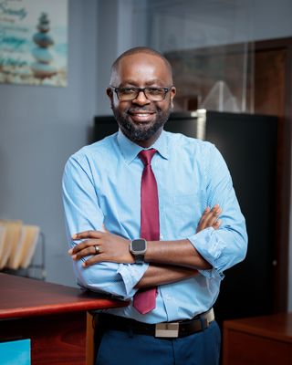 Photo of Dr. Moses Mbugua, Psychiatric Nurse Practitioner, PsyD, PMHNP, APRN