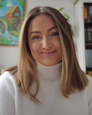 Photo of Sarah Moore, Registered Psychotherapist (Qualifying), BA, MA, RP(Q)