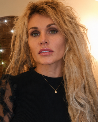 Photo of Dr. Cheri Hausmann, Marriage & Family Therapist, PhD, LMFT, E-RYT