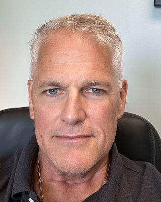 Photo of Dr. John M. Brion, Psychiatric Nurse Practitioner, PhD, PMHNP-C