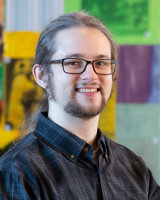 Photo of Alex Larson, Licensed Professional Clinical Counselor, MPS, LPCC, LADC
