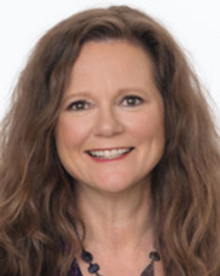 Photo of Kim Stuart, Registered Psychotherapist (Qualifying), HonsBA, MEd, MACP