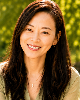Photo of Yvonne Zhu, Registered Psychotherapist (Qualifying), CFA, MFIN