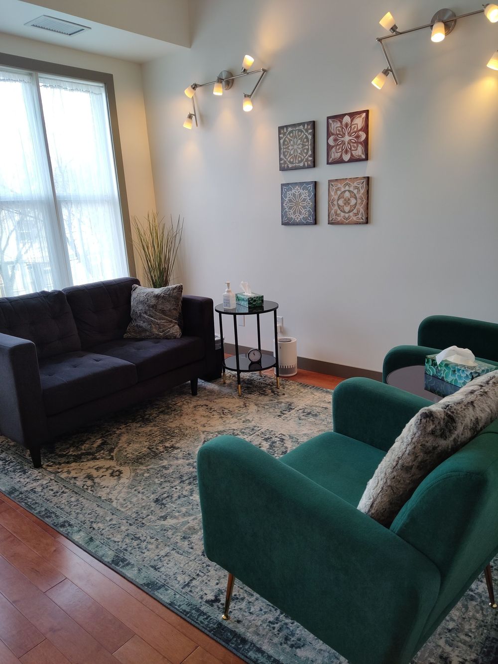 Welcome to my therapy space! There's a comfy couch for clients and plenty of Kleenex. Colourful decor was chosen for a sense of warmth and reflection.