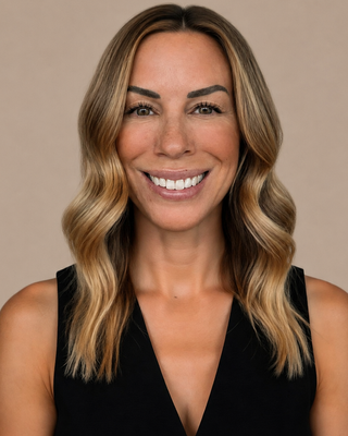 Photo of Mindi Lobuzzetta, Counselor, LMHC-D