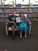 Gallery Photo of Ben, a brave wounded warrior, fell in love with Pink & her book, Pink, The 3 Legged Dog Who Lost Her Leg and Found Her Courage. Read at Camp Pendleton