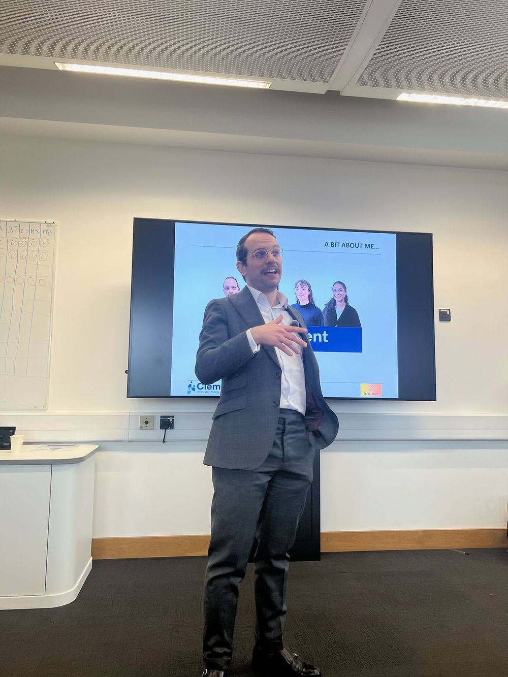 Clement Mind speaker giving a professional career talk at Anglia Ruskin University, presenting psychology and mental health services to students.
