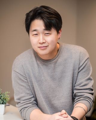Photo of David Qi, Counsellor, RCC