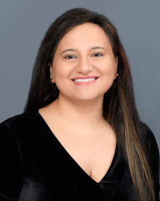 Photo of Rini Sharma, PhD, MA, PGAMH, Registered Psychotherapist