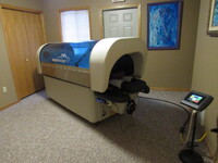 Gallery Photo of The Aqua Massage machine allows a person to get a head to toe massage without human touch or getting undressed. You are fully dressed in this machine.