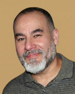 Photo of Ambrose Resa, Counselor, MA, LMHC, LCPC