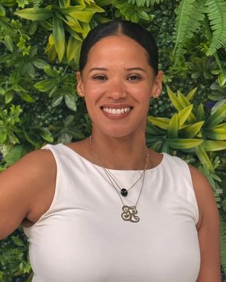 Photo of Regina De Los Santos, Licensed Mental Health Counselor, LMHC, MCAP, QS