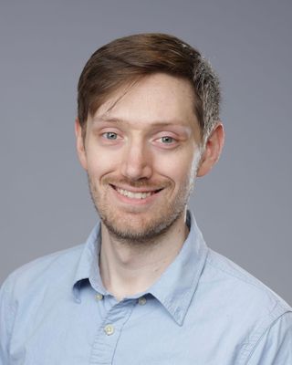 Photo of Evan Schwartz, Licensed Master Social Worker, LMSW, PhD