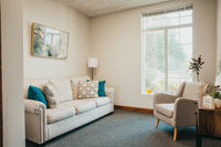 Gallery Photo of We invite you to be comfortable in our space. Cozy up on our couch with a warm beverage and let's chat!