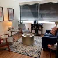 Gallery Photo of Enjoy your session in a cozy space with natural light and comfy seating.