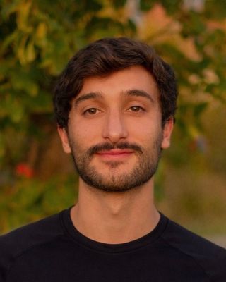 Photo of Ethan Askarinam, Licensed Professional Counselor Candidate, MA, LPCC, CPT, CNC, RYT200