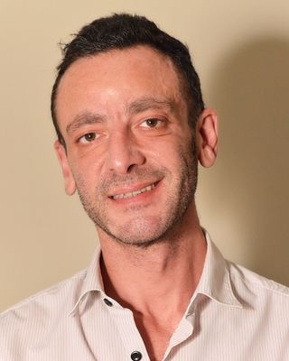 Photo of Genghis Ahmed, Psychotherapist, MSc, MBABCP