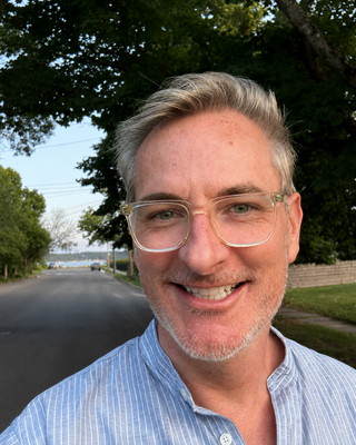 Photo of Austin Dowling, Counselor, LMHC, MSEd, LLB, Sol
