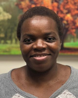 Photo of Consola Esambe, MD, Psychiatrist