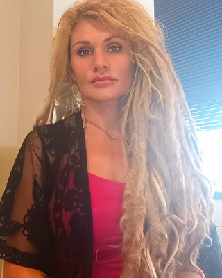 Photo of Dr. Cheri Hausmann, Marriage & Family Therapist, PhD, LMFT, E-RYT