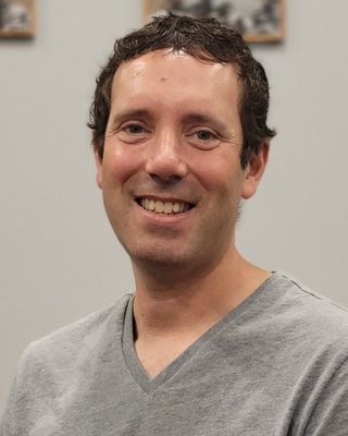 Photo of Adrian Zelvy, Counselor, LCPC