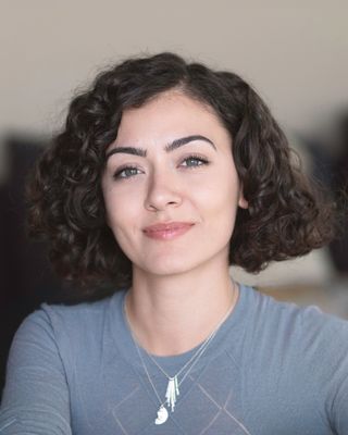 Photo of Andra Oprisanu, Psychotherapist, UKCP Trainee