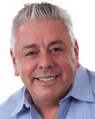 Photo of Alberto Tcah, Counselor, LMHC