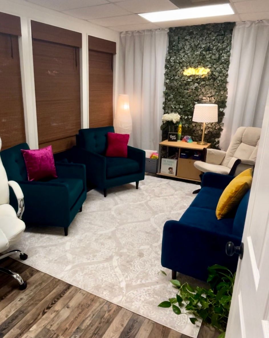 A little peek into my space! Complete with cozy chairs, a glider rocker, calming blanket, soft lighting, and toys for kids ages 5 to 95. Let's chat! 