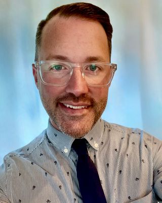 Photo of Topher Raposo, Licensed Professional Counselor, LCMHC, LMHC