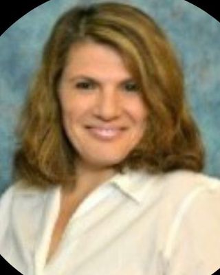 Photo of Zhanna Berman, Psychiatric Nurse Practitioner, PMHNP-B, FNP-BC, CHES
