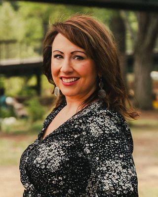 Photo of Amelia Kelley, Licensed Professional Counselor, PhD, MS, LCMHC, ATR, RYT