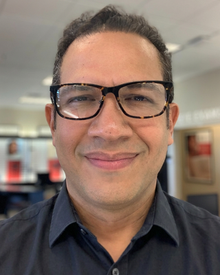 Photo of Dr. Juan Bautista Peña - Dr. Juan B. Peña PhD, LCSW, PhD, LCSW