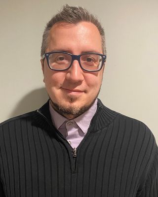 Photo of Travis Manrique, MA, LPC, ACS, Licensed Professional Counselor