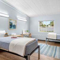 Gallery Photo of Soothing colors and comfortable beds