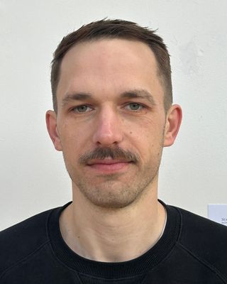 Photo of Caleb Whitefield, Counsellor, UKCP Trainee