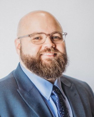 Photo of Justin Smith, Licensed Professional Clinical Counselor, MA, NCC, LPCC-S, RPT-S™