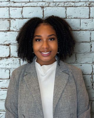 Photo of Alexis N Fintchre, Licensed Clinical Mental Health Counselor, LCMHC, CCTP, NCC, ACS